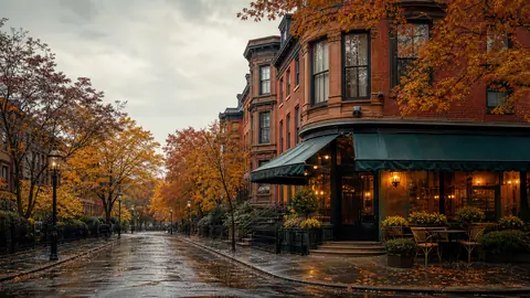 Brownstones and autumn trees on a rainy street